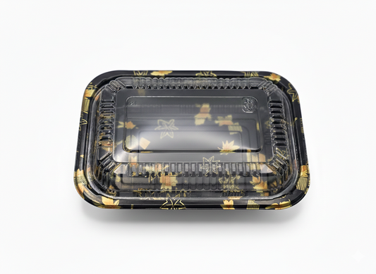 Black and gold rectangular food container on a white background