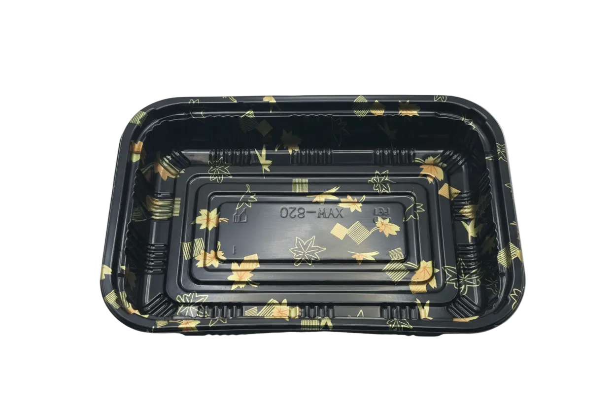 Black plastic container with gold patterns on a white background
