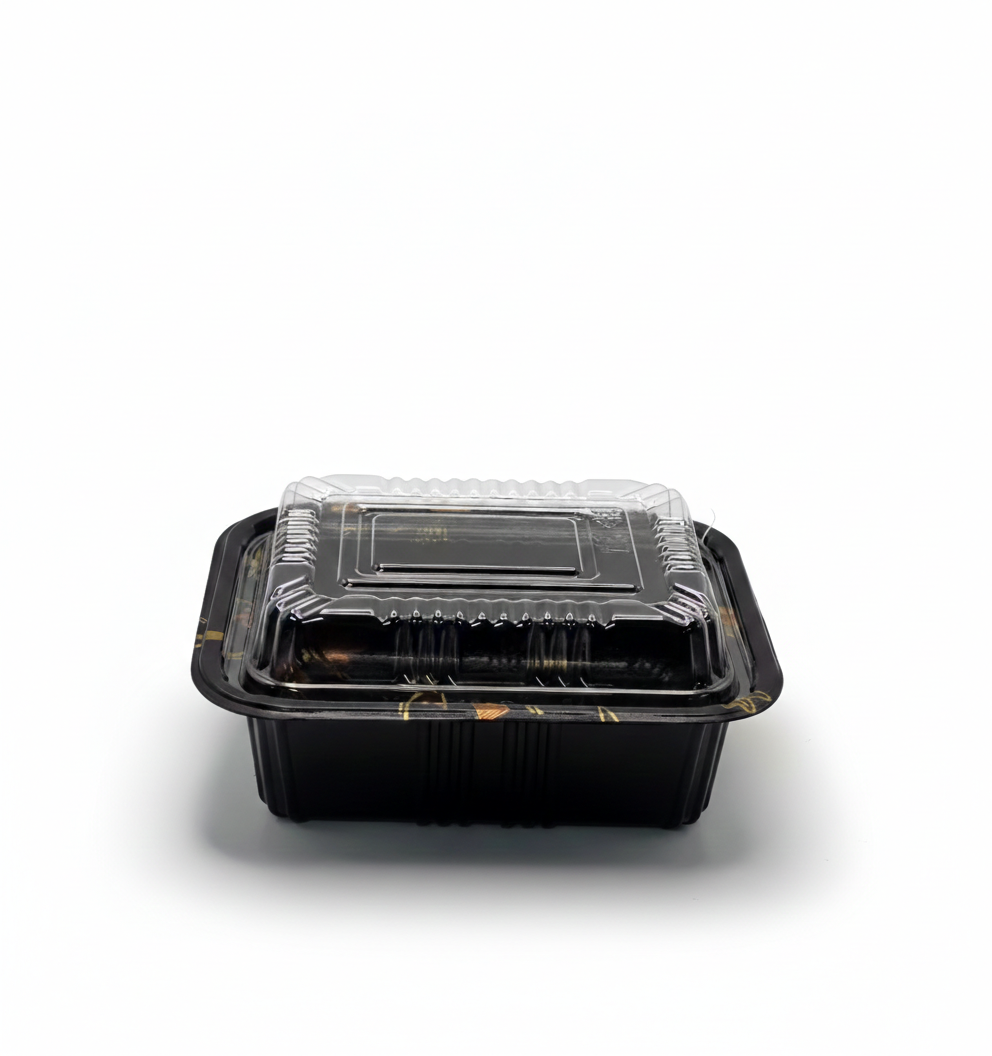 Black food container with clear lid on a white background
