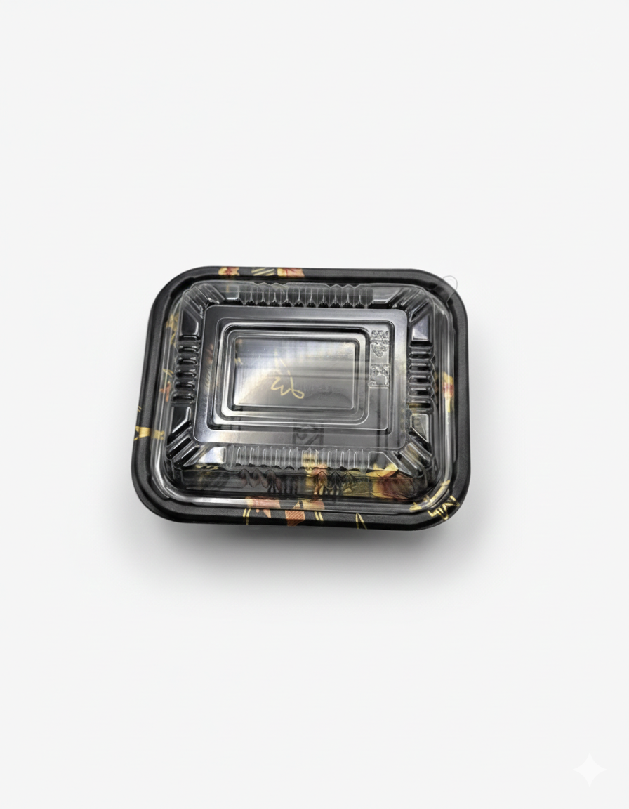 Black rectangular food container with clear lid on a white background