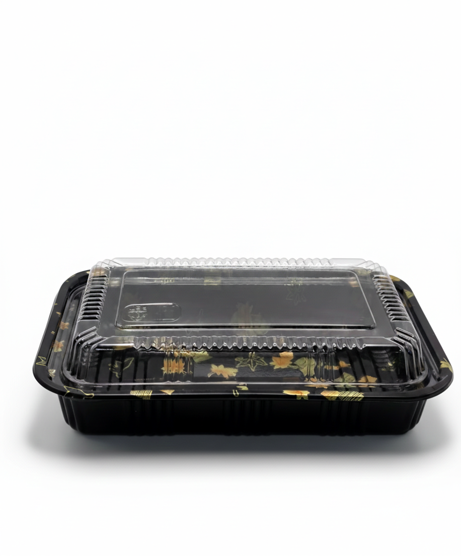 Black rectangular food container with a clear lid on a white background