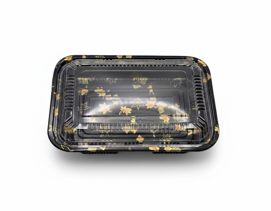 Black plastic food container with floral design on a white background