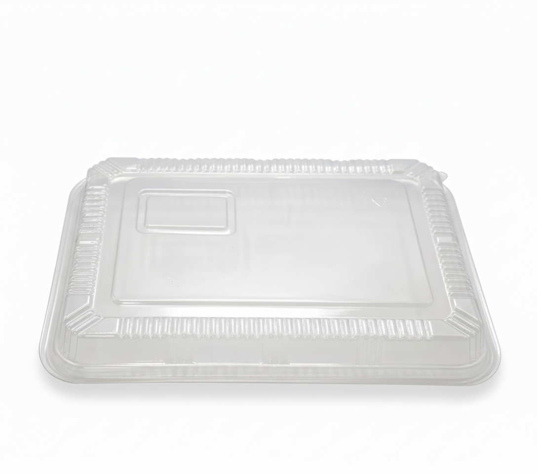 Clear plastic food container lid on a white background