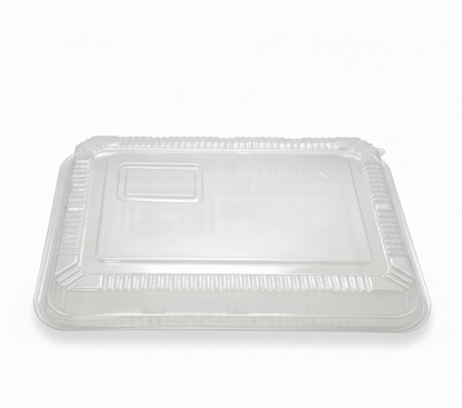 Clear plastic food container lid on a white background