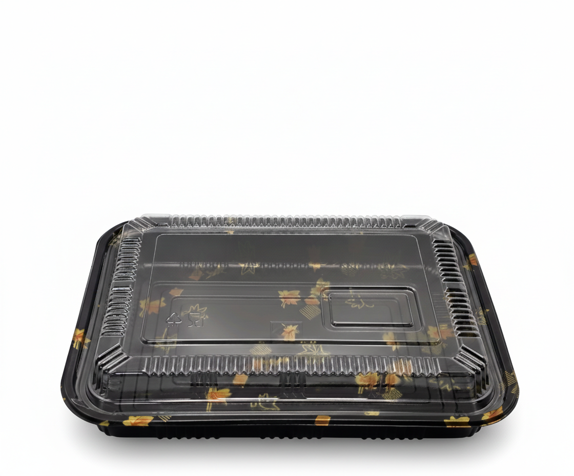Black plastic food container with clear lid on a white background