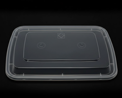 Clear plastic container with a black lid on a black background