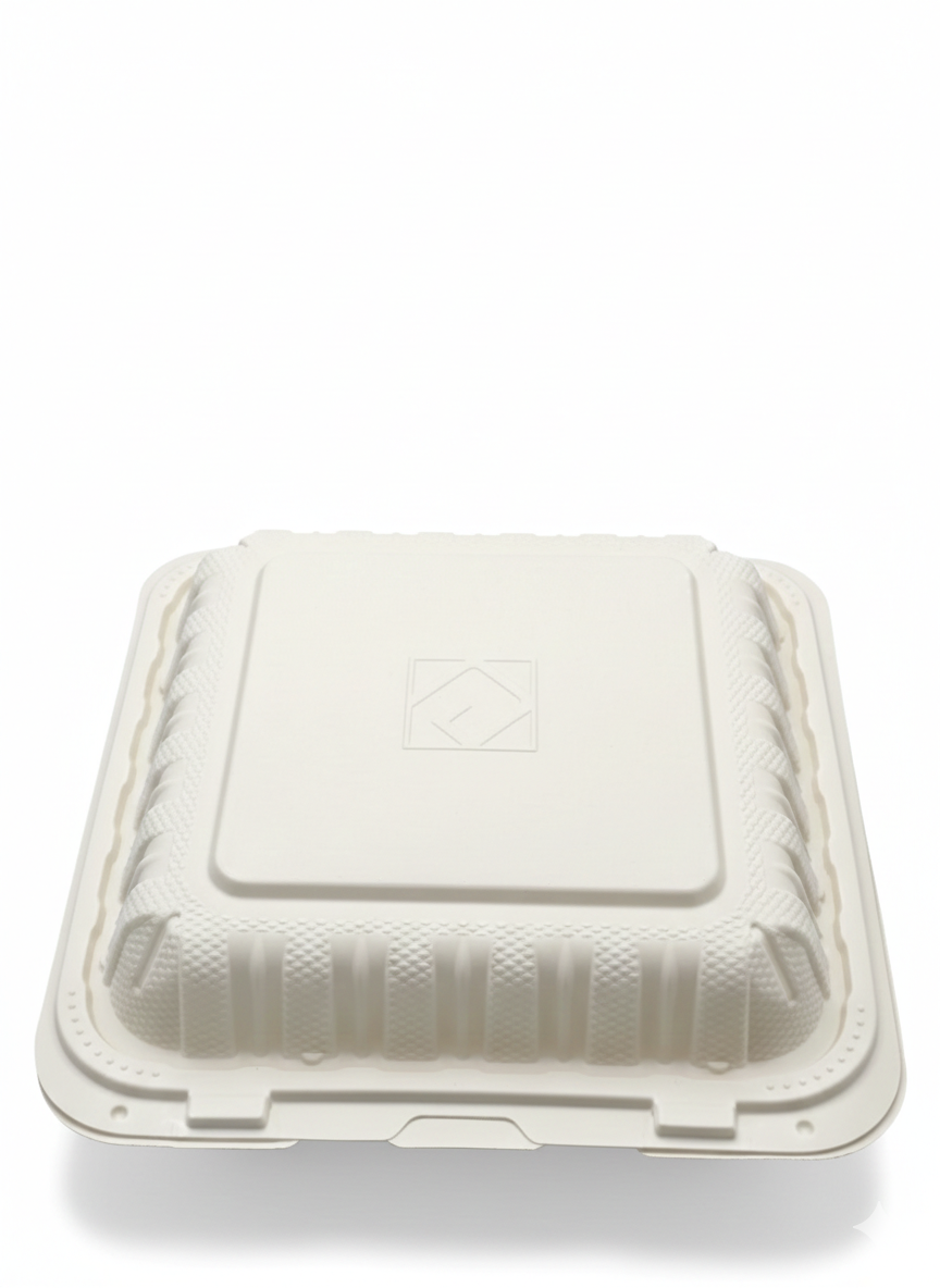 White disposable food container with a lid on a white background