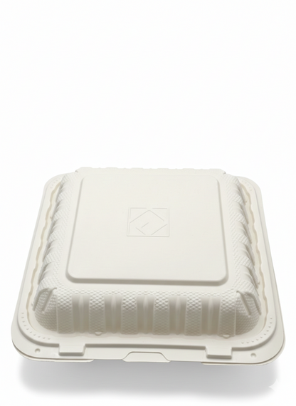 White disposable food container with a lid on a white background