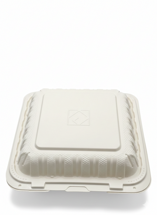 White disposable food container with a lid on a white background