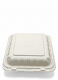 White disposable food container with a lid on a white background