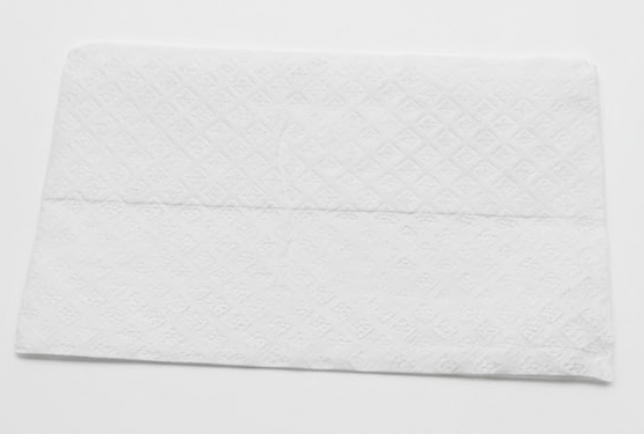 White textured towel on a light gray background