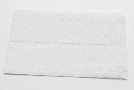 White textured towel on a light gray background